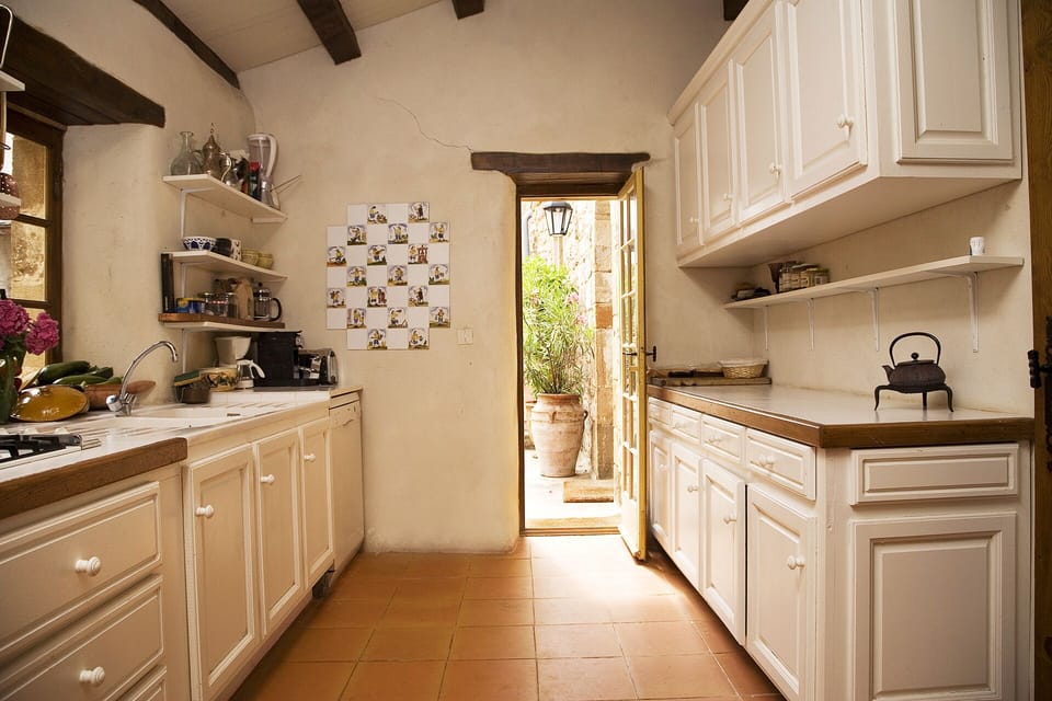 Kitchen, fully equipped to cook for up to 14. Giving onto interior terrass.
