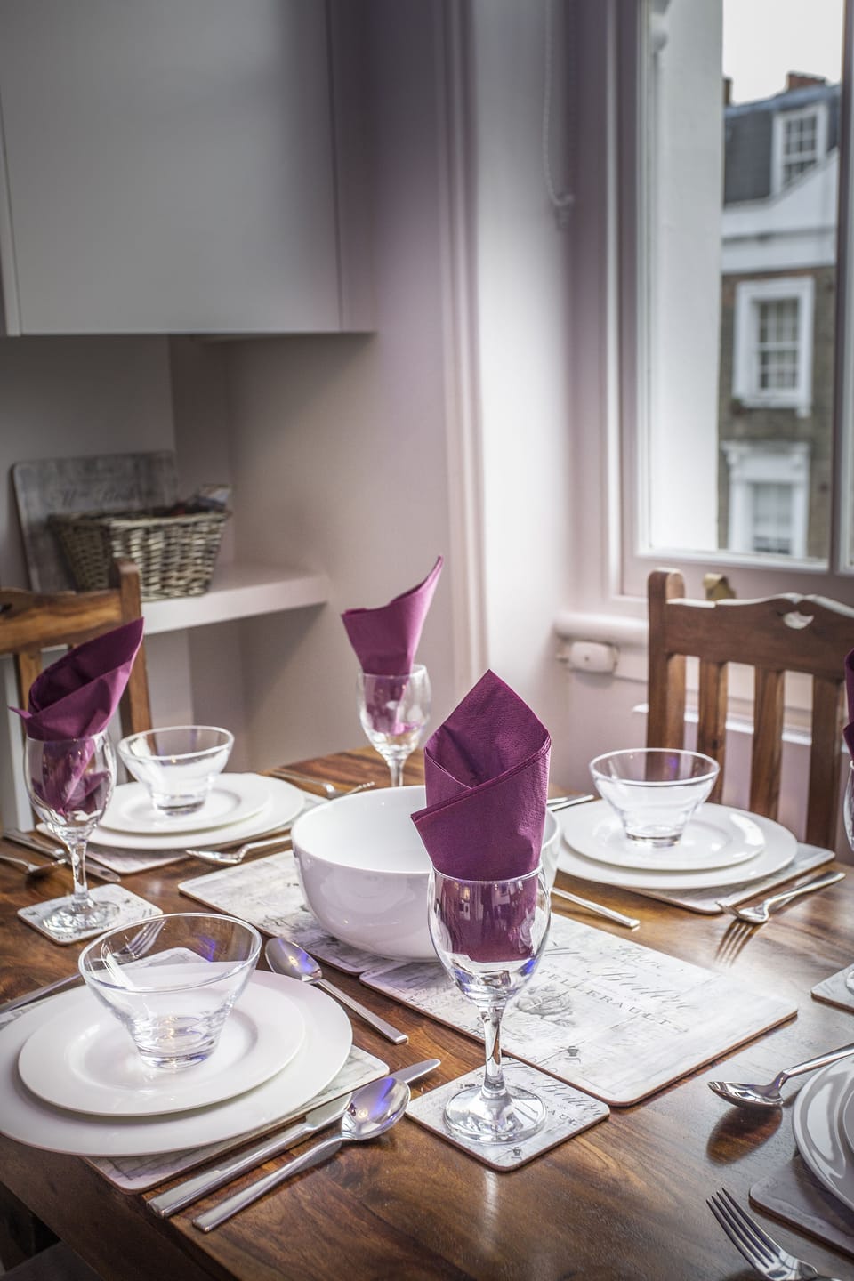 Bone china place settings and good cutlery and glassware