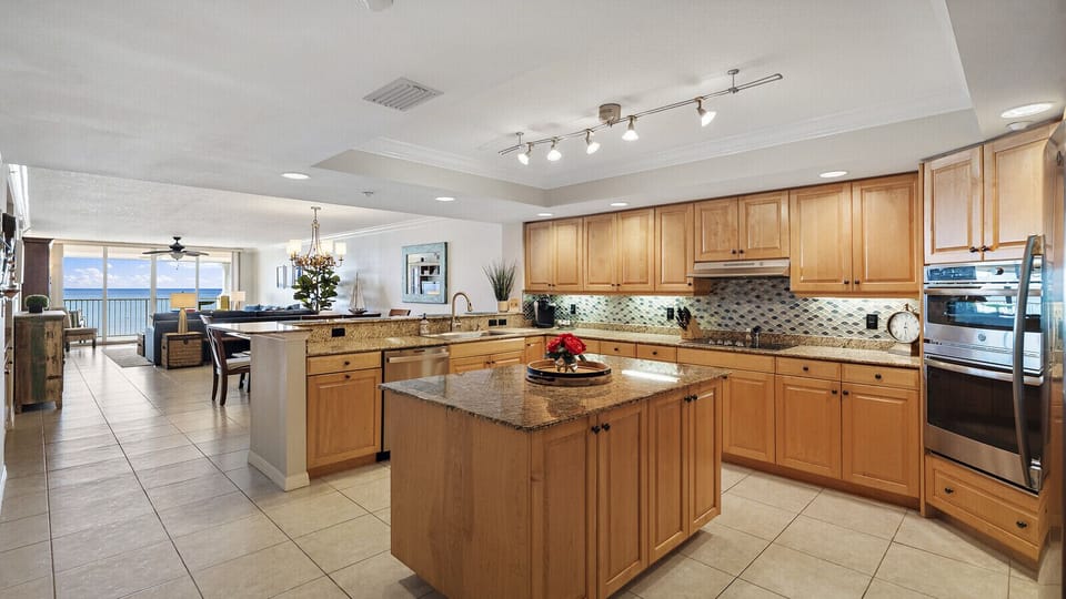 Large custom kitchen with an island and beach views