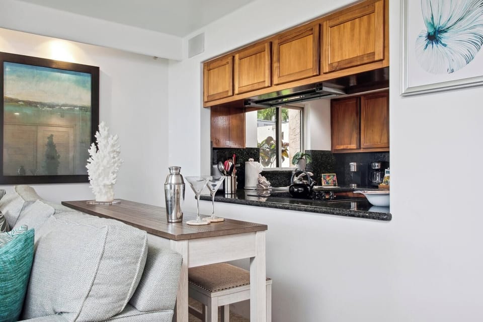 Fully equipped kitchens include modern appliances, granite countertops, and everything needed to prepare meals during your stay.