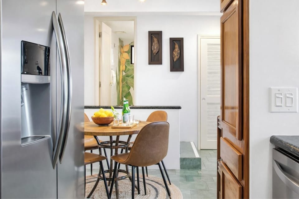 Fully equipped kitchens include modern appliances, granite countertops, and everything needed to prepare meals during your stay.