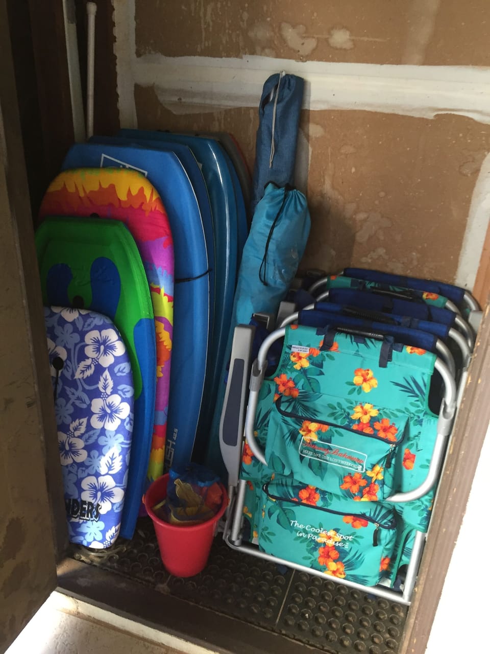 Lots of beach items  in the lanai closet, beach chairs, boogie boards, cooler