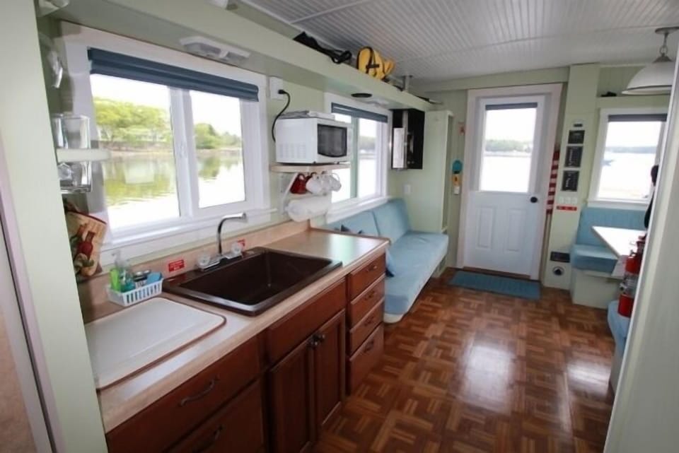 Full size kitchen sink, pots,pans,dishes, glasses,Microwave. Settee sleeps one