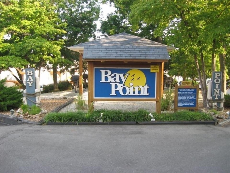 Entrance,  parkette with picnic tables and charcoal grills