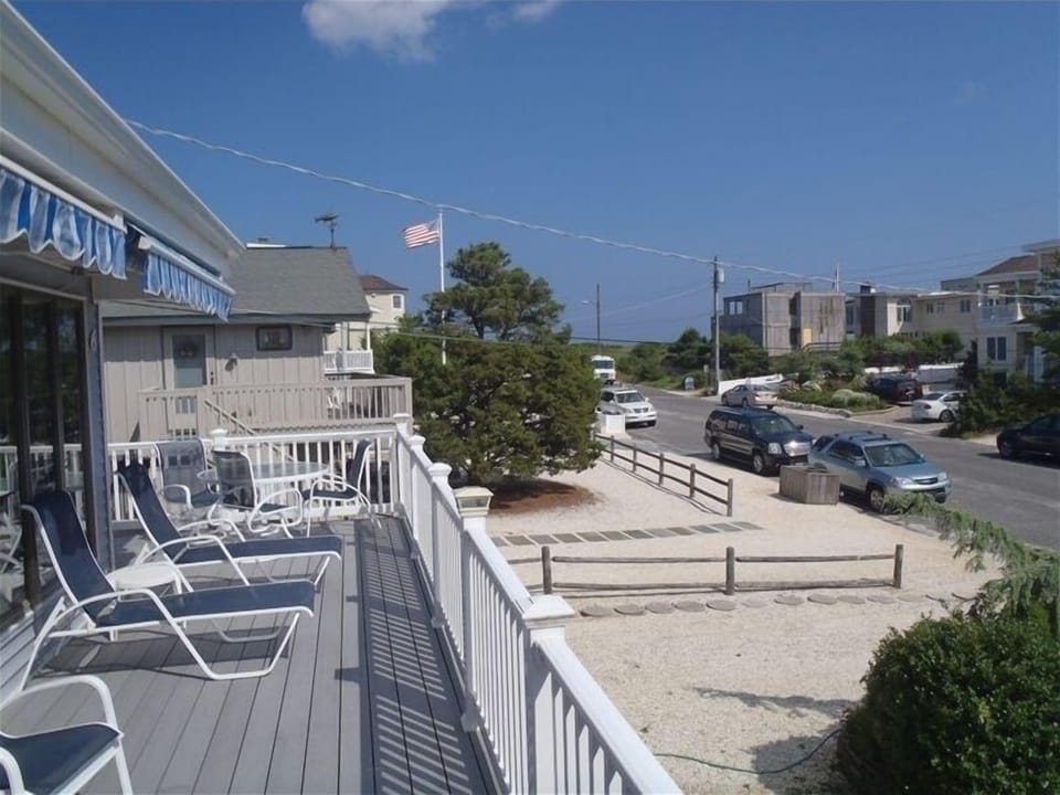 Outside deck, past flag is beach