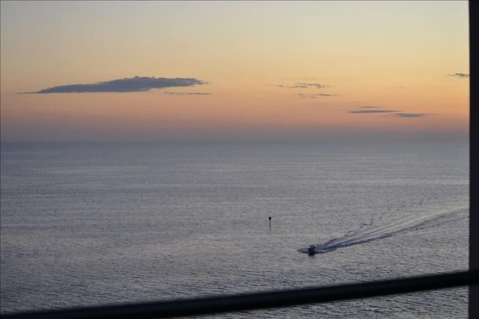 Relax with at dusk and watch the boats cruise past.