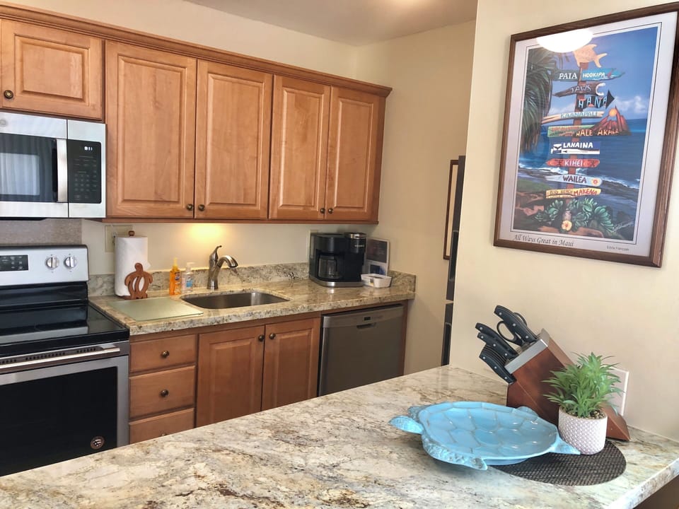 Modern kitchen with all stainless appliances and new granite counters.
05/2025