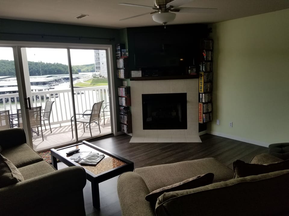 Living room: 55 inch Big screen TV above fireplace.  Lots of movie choices here