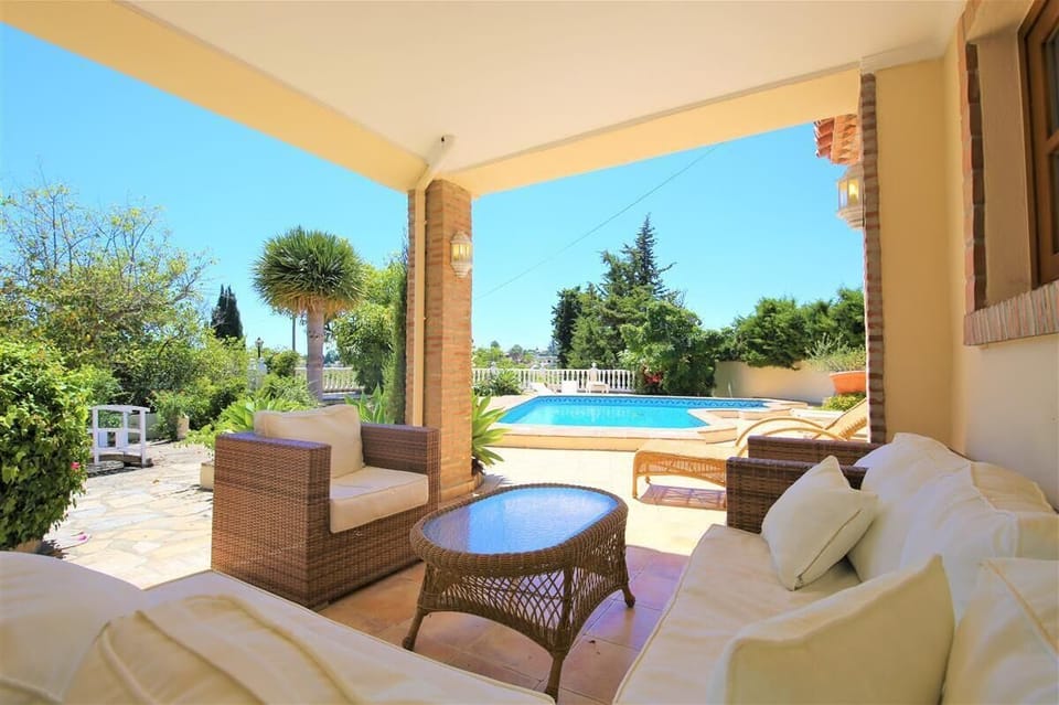 Relaxed shady terrace area by the pool