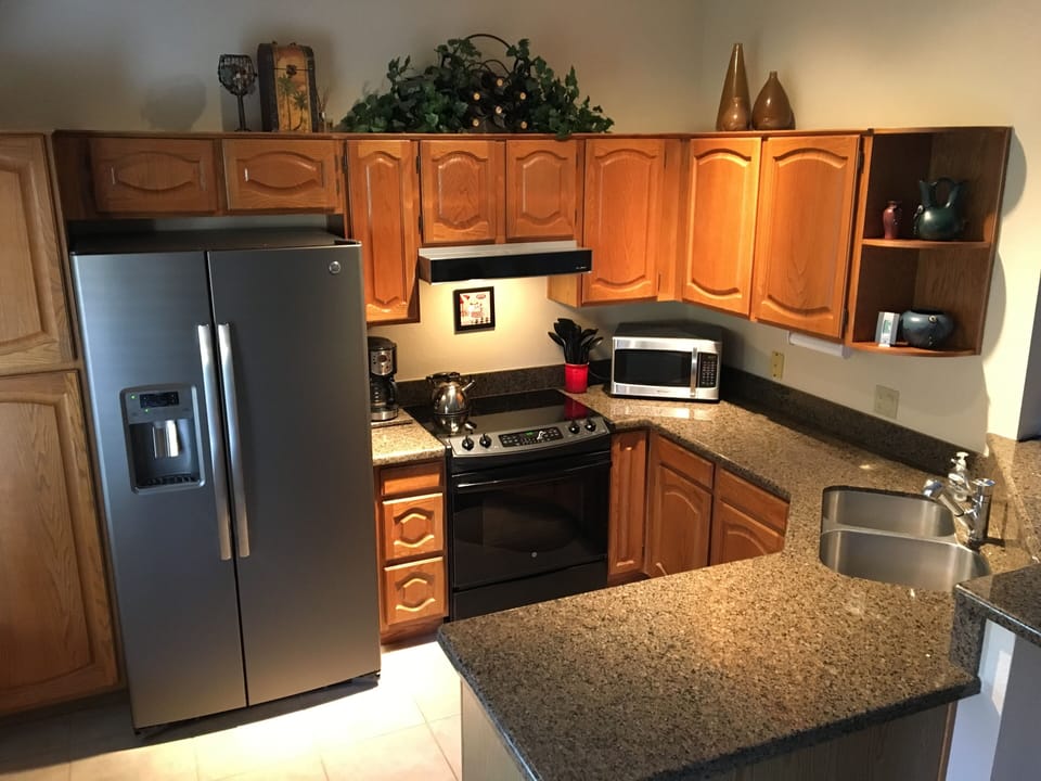 Remodled Kitchen New Range, Refrigerator, Granite Counter and tile floor.