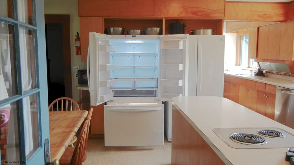 Main House eat-in kitchen includes 2 large refrigerators & separate pantry room.