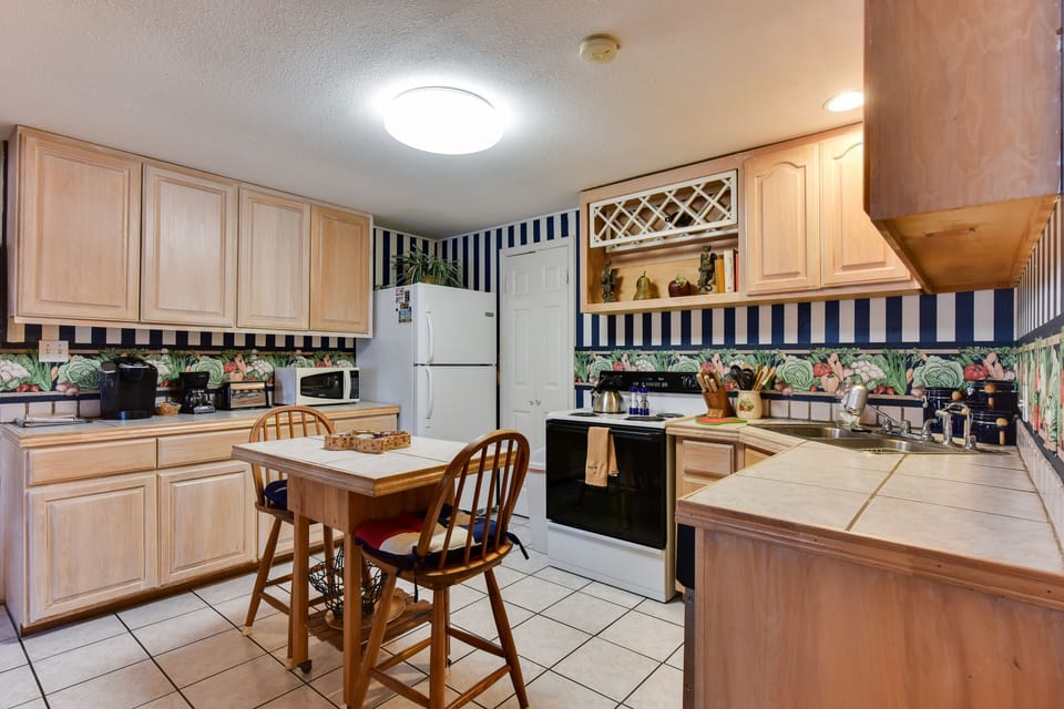 Kitchen area with small bar/breakfast eating