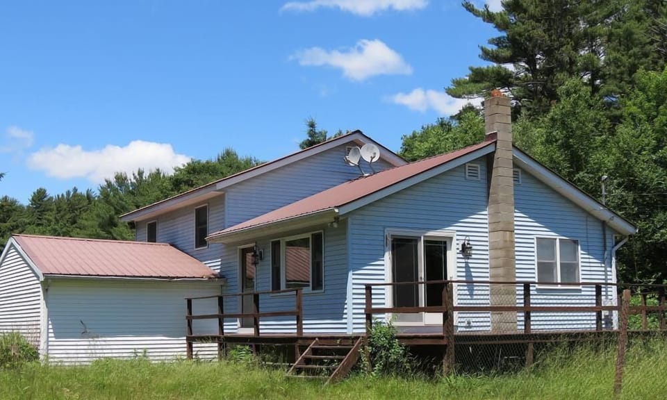 Front of house with large deck