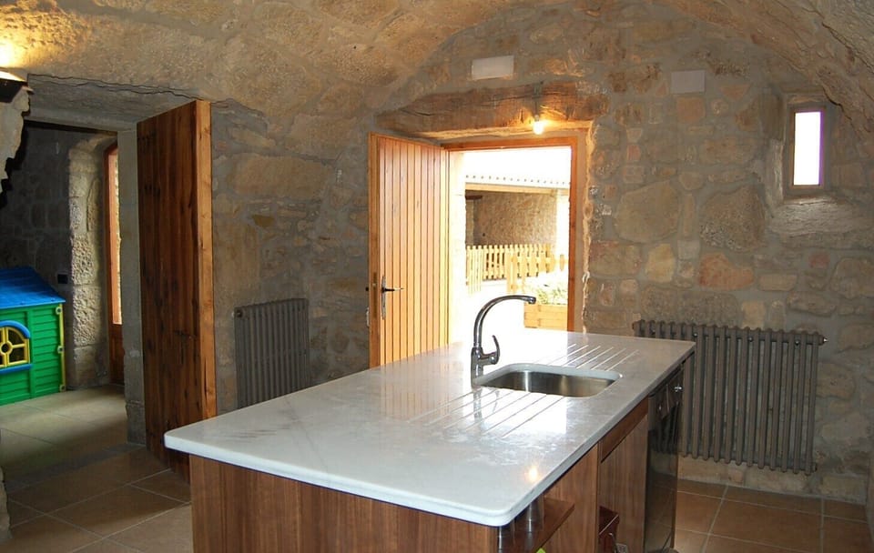 Next to the pool and BBQ is an extra kitchen