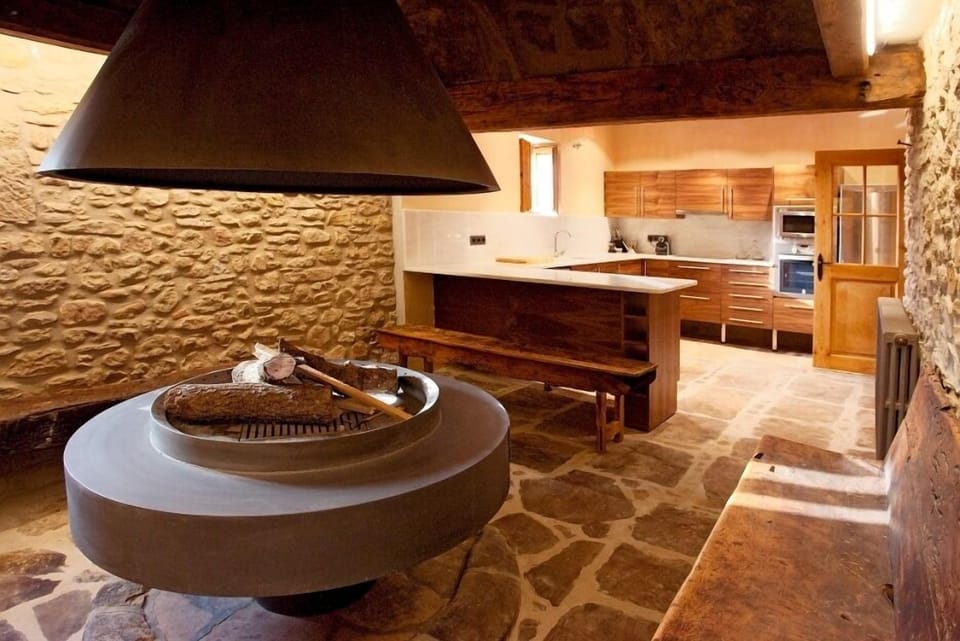 Very uniquely, Masia Claudia has an indoor grill with surrounding benches