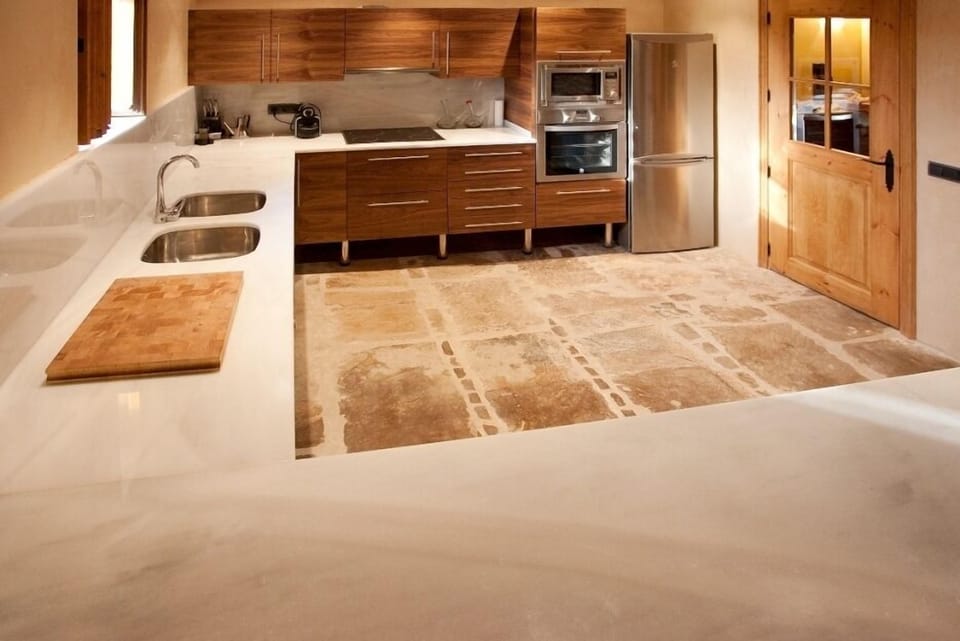 The big kitchen with a large marble table has everything you will need