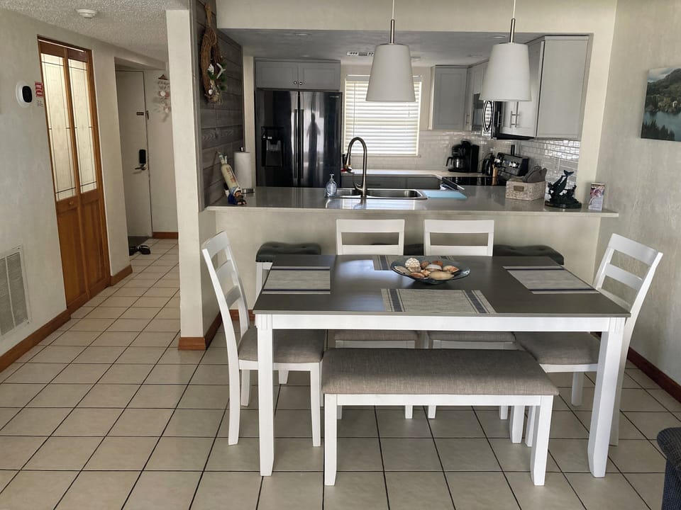 Dining area with pull up to kitchen counter seating as well.