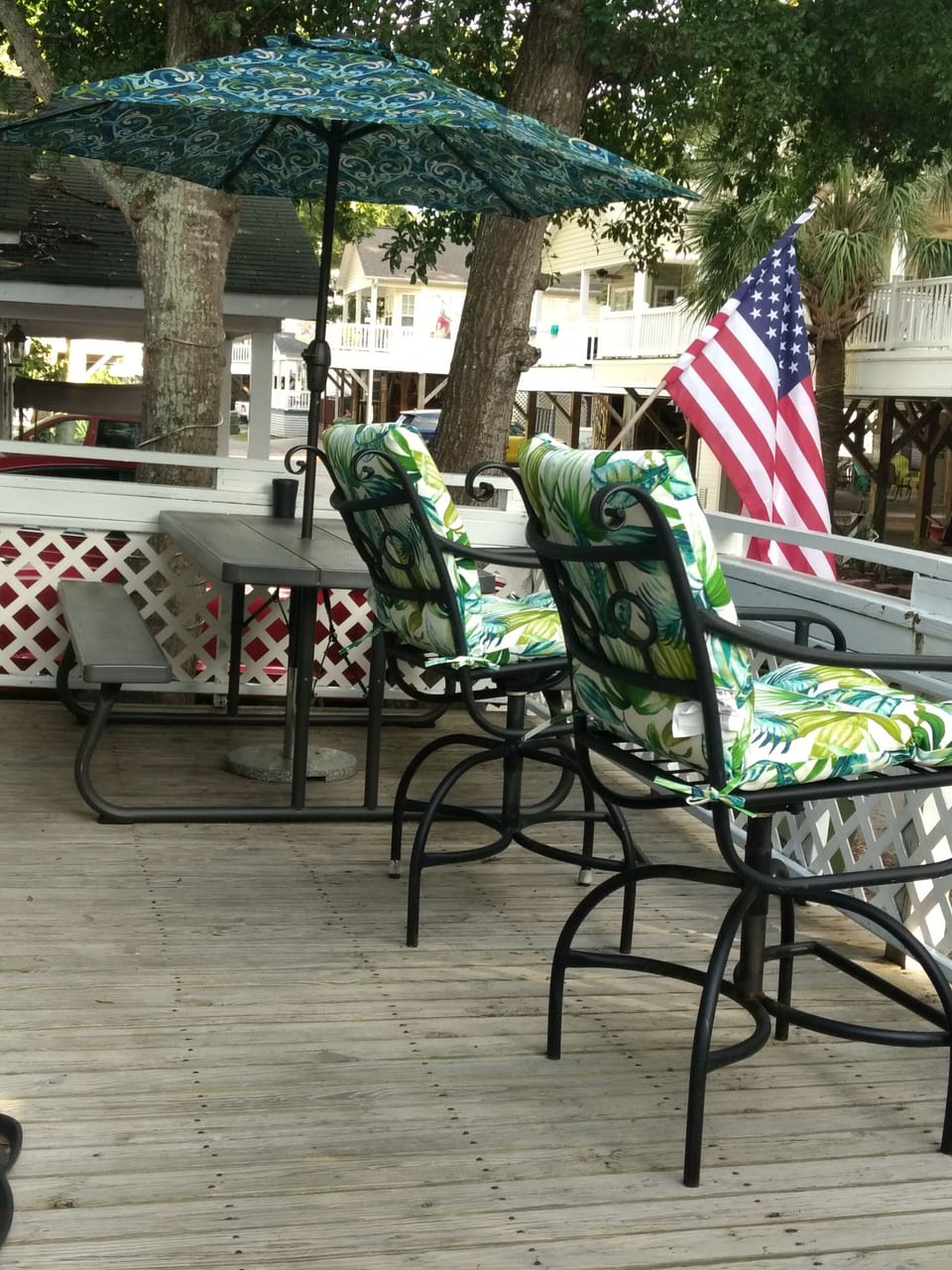 Relax on the deck with comfortable tall swivel chairs or picnic table....