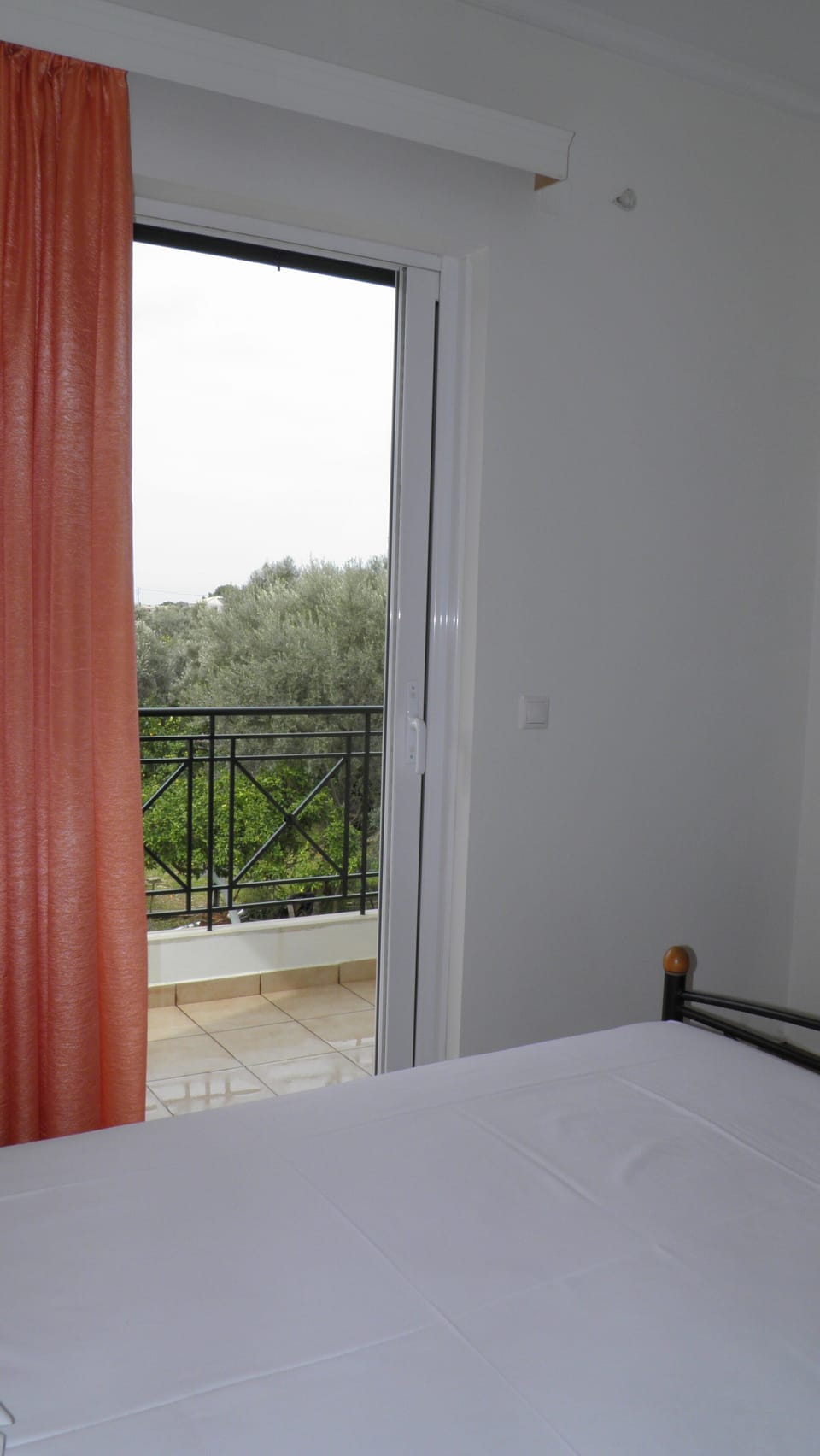 Bedroom with view from balcony
