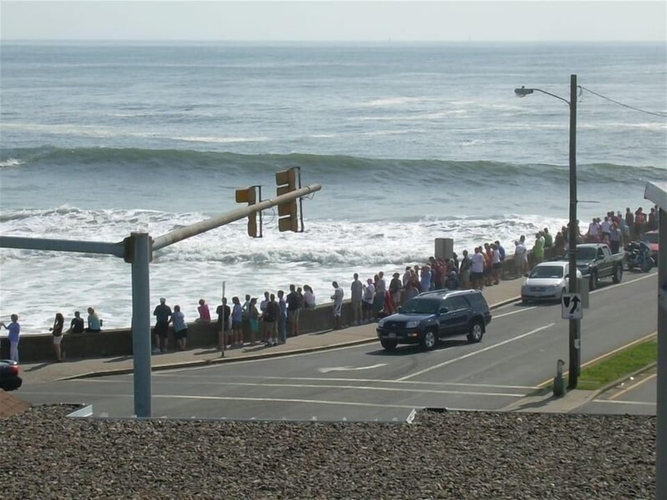 Walk across the street to the seawall and beach to watch the surfers 