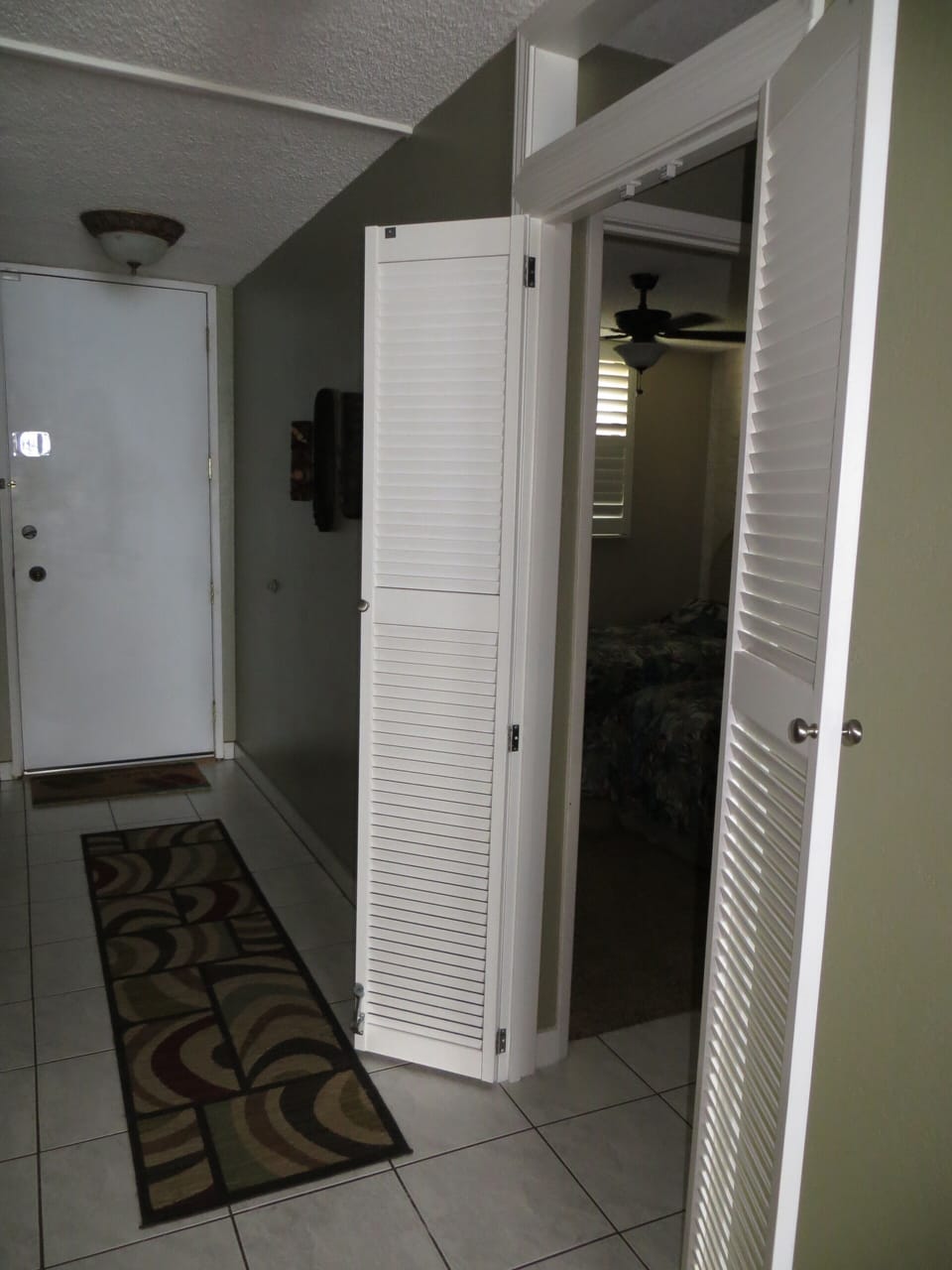 Double doors provide privacy for guest suite with private bathroom