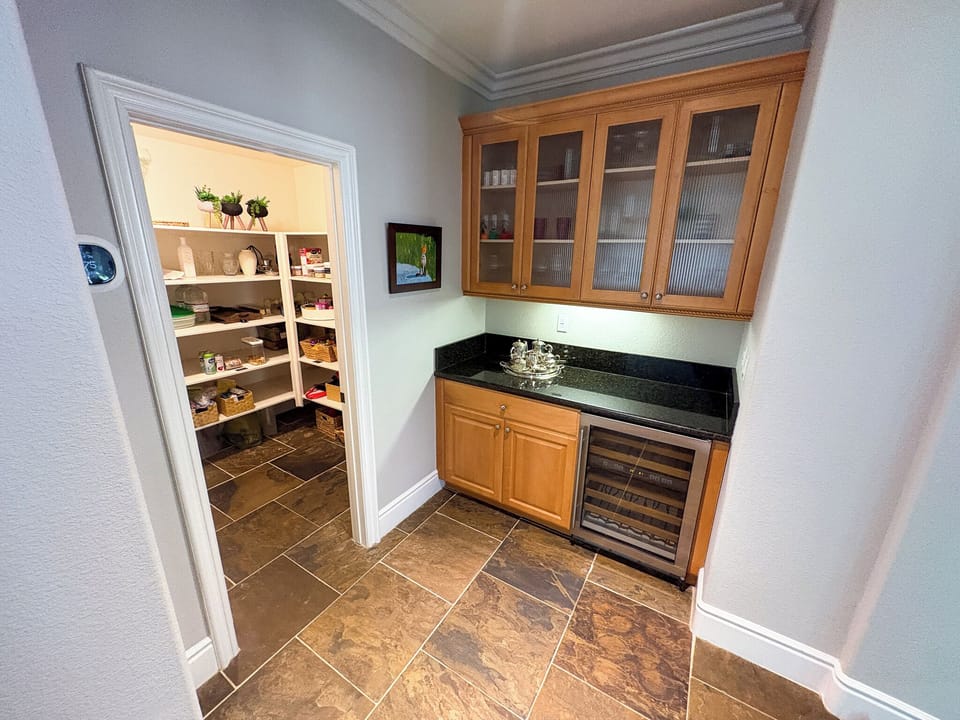 Walk-in pantry and Butler's pantry with SubZero dual-zone wine refrigerator