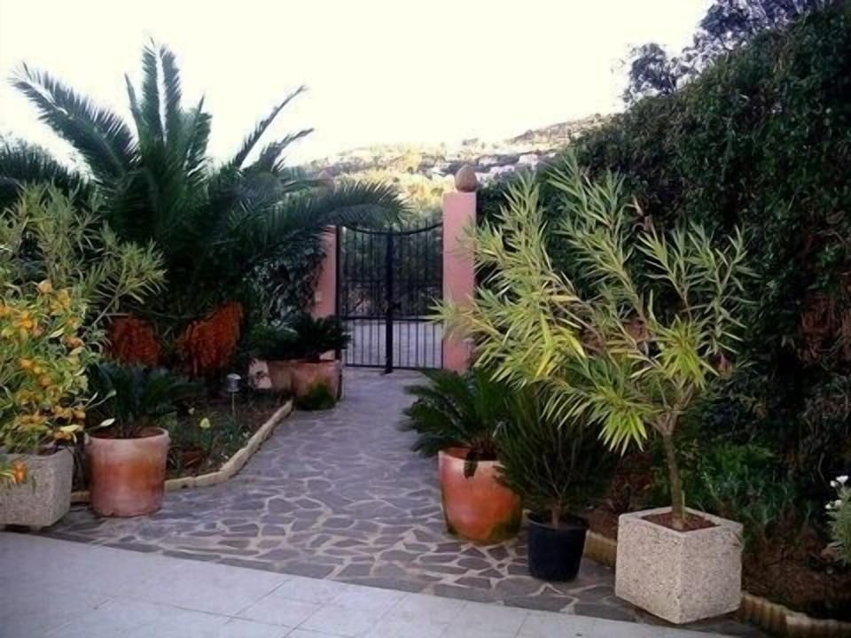 Garden Gate and parking area beyond