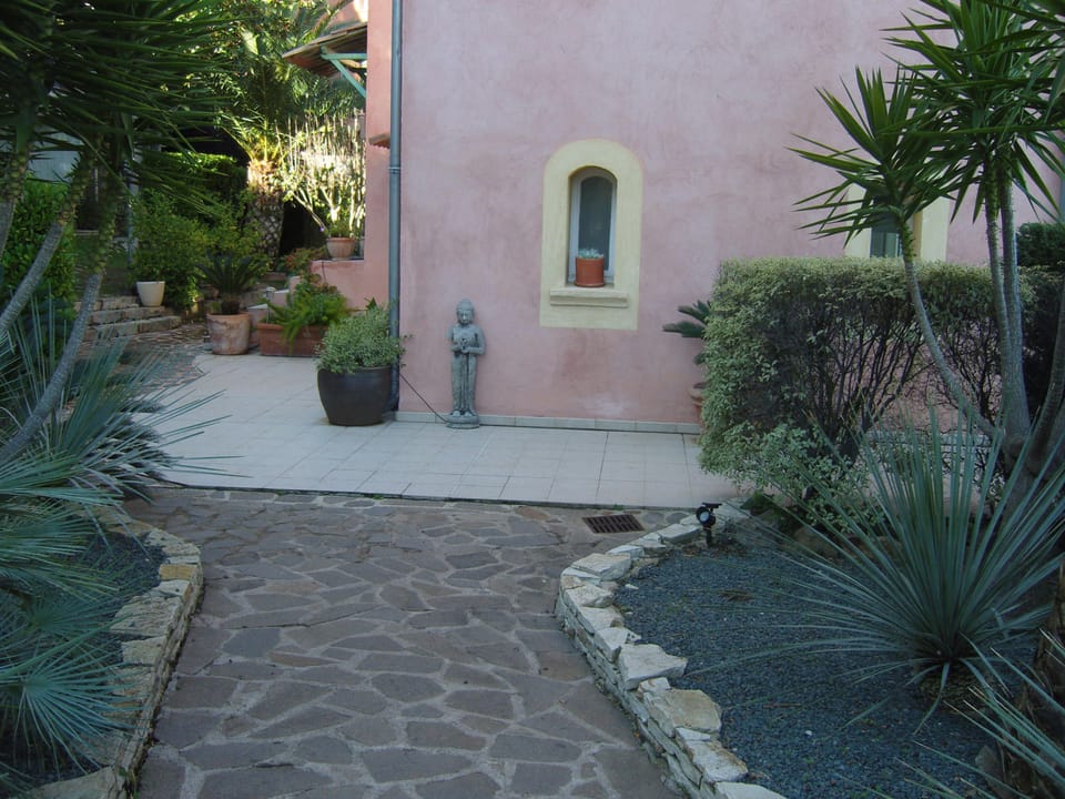 Approaching the apartment from the garden gate