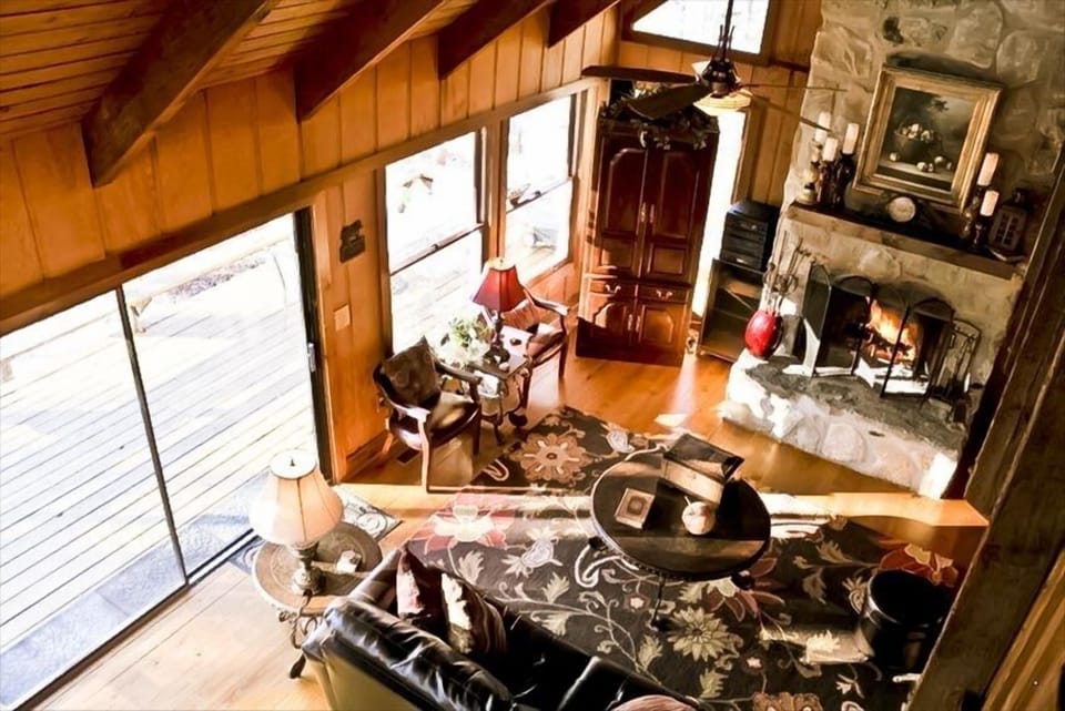 Spacious Family Room with Vaulted Ceilings and Large Windows that overlook lake