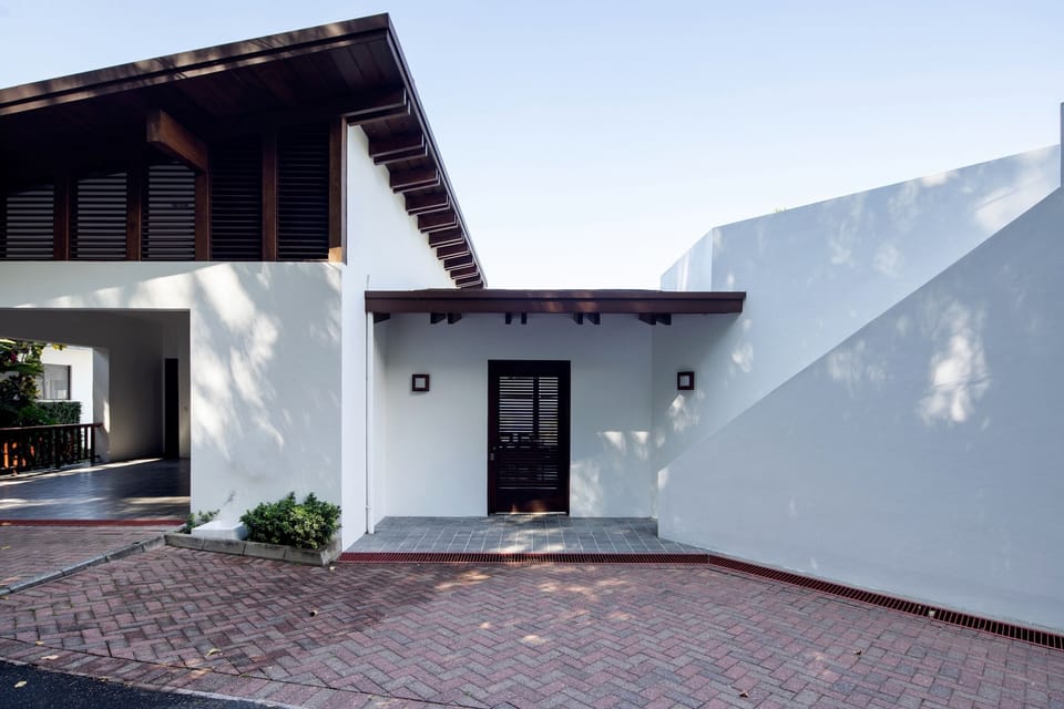 main door, garage (right) and staircase to the rooftop (left)
