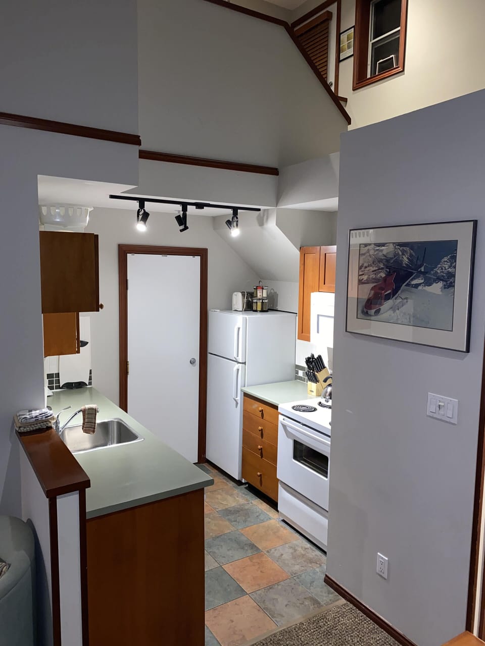 Powder washroom right across from kitchen, (contains a toilet and a sink)
