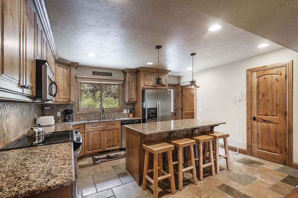 Stunning gourmet kitchen with all the household appliances and cookware needed.