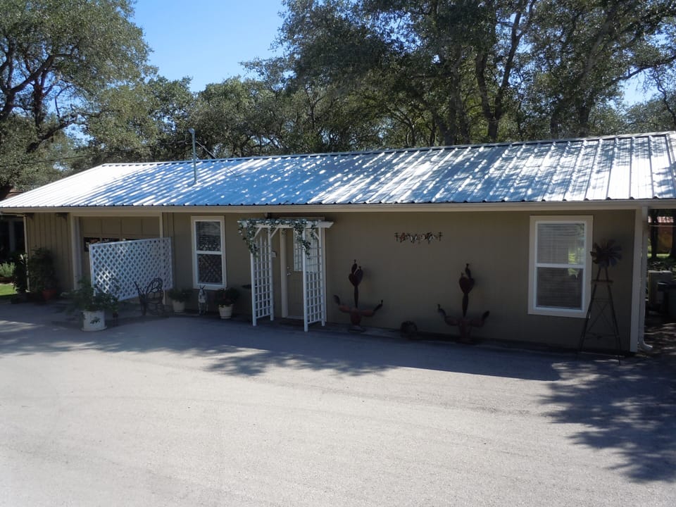 Entrance to your cottage with privacy lattice fence and sitting area.  