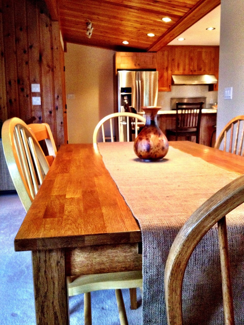 Open kitchen and dining area, seating for 6 at dining table.
