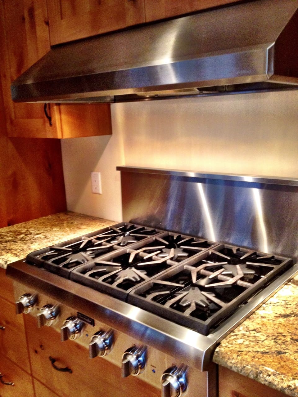 Stocked kitchen with high end appliances, cook ware, spices and condiments