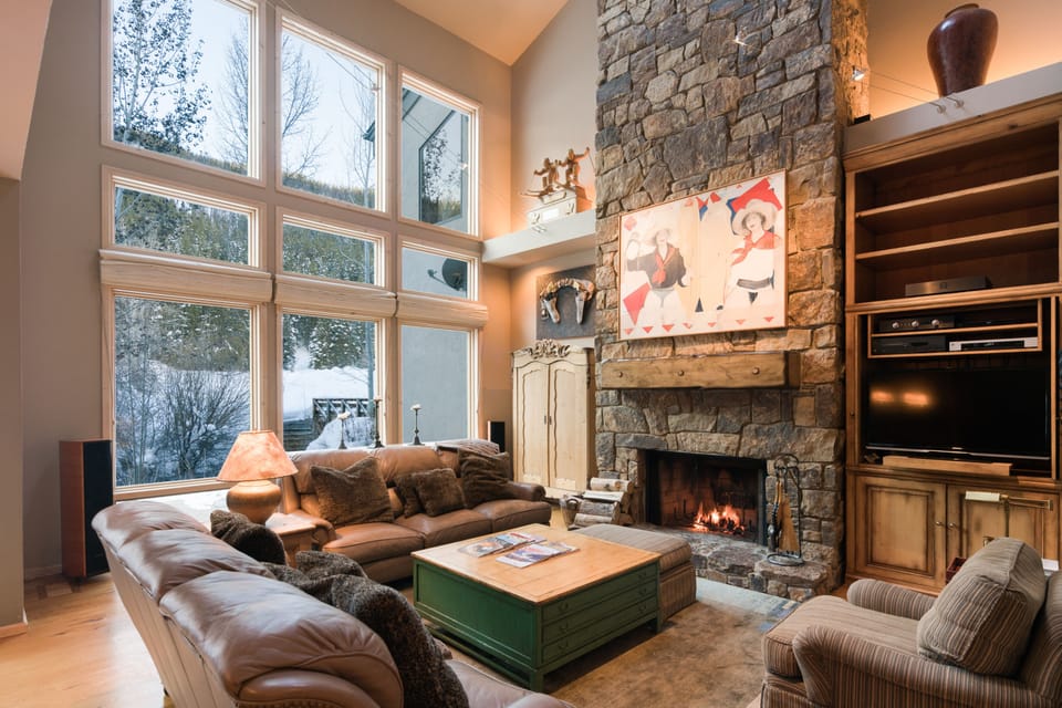 Spacious living room with views of Bald Mt. and fireplace... high ceilings.