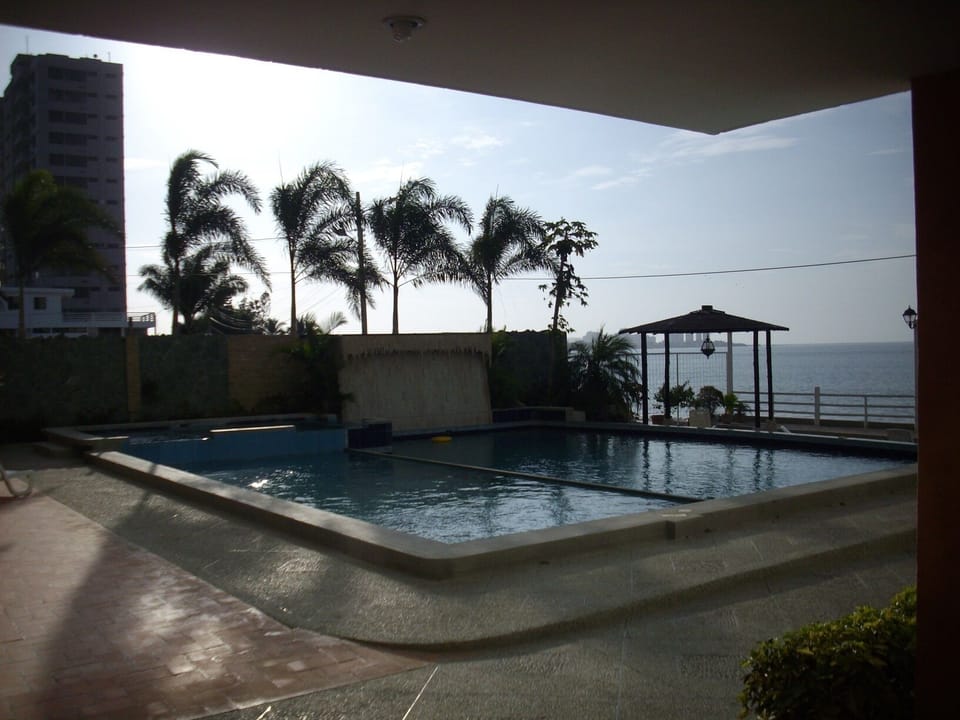 Pool area has BBQ grill, sunbathing patio and gazebo's for hammocks