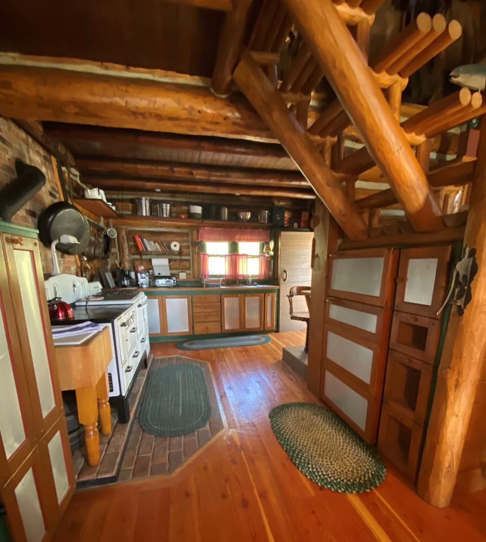 Beautiful kitchen with plenty of cookware and dishes.