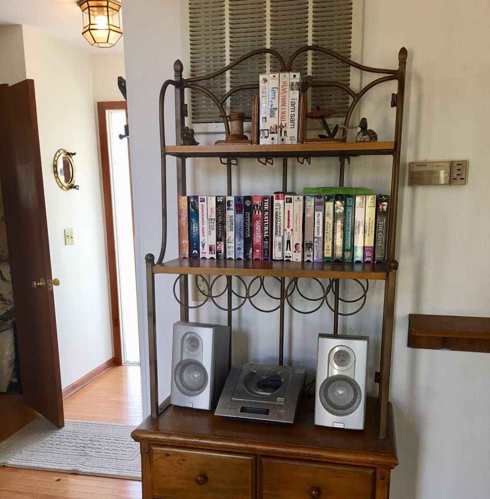 Stereo with CD player and VHS library (house has DVD/VHS player)