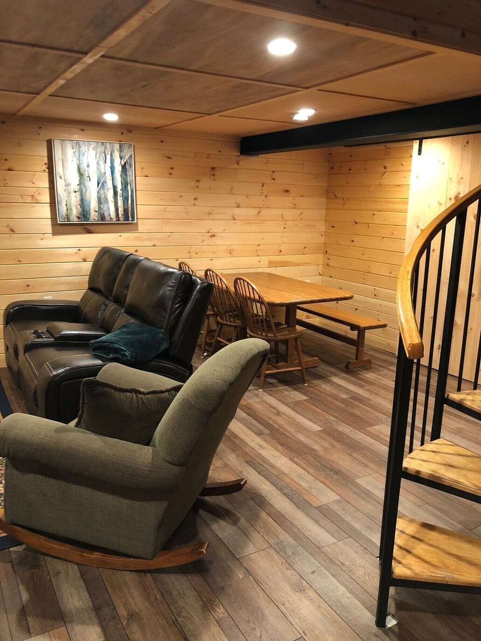 Finished basement with game area, TV, foosball table, bedroom and bath