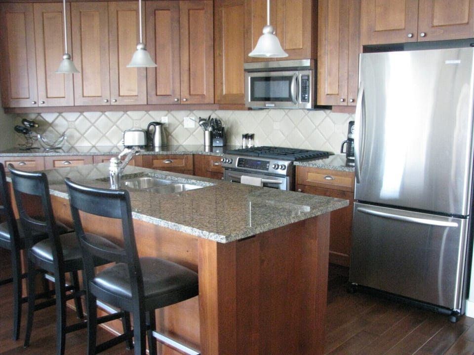 Kitchen with every amenity and room for 3 to sit at granite counter