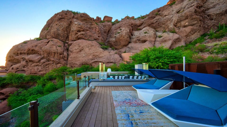 Cabana beds deck on rooftop with outdoor bar, fire features, & immaculate views