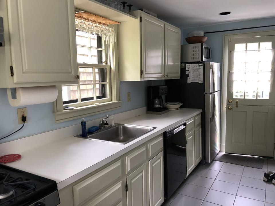 New stainless refrigerator & rear door for grocery access

