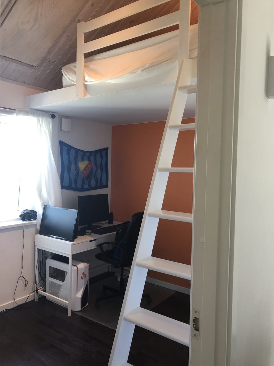 Orange bedroom: Loft with a queen bed that sleeps 2