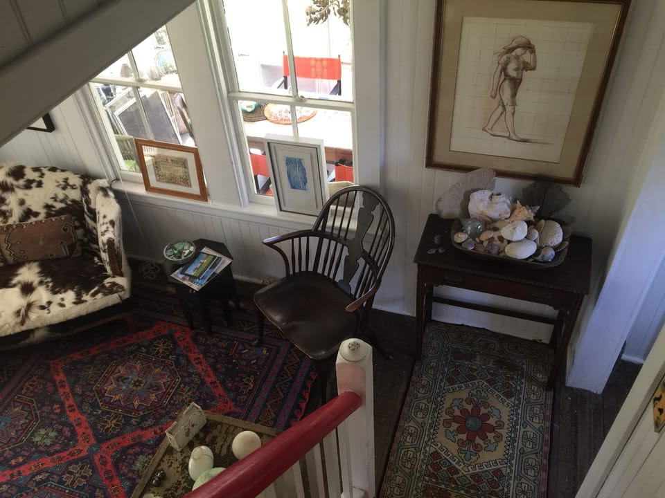 Second parlor from the stairs. Lots of art and antiques!