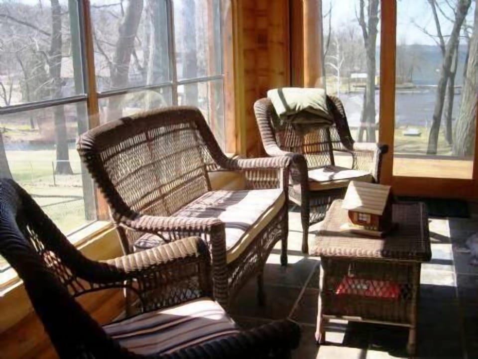 Play games in this wonderful 4 Season Room heated by a warm stone fireplace.