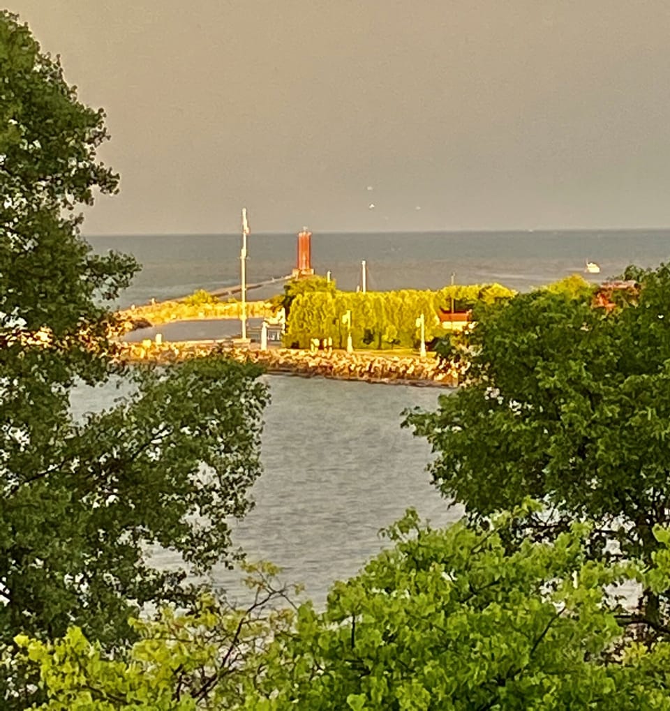 Lighthouse and marina enhance the view from the veranda