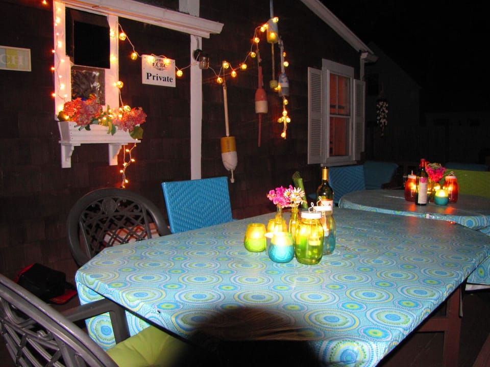 Evening dining on the deck with white tea lights 