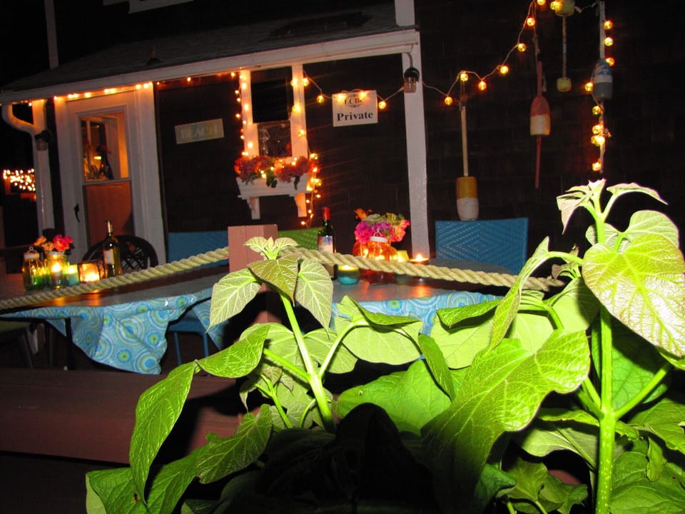 Evening dining on the deck with white tea lights 