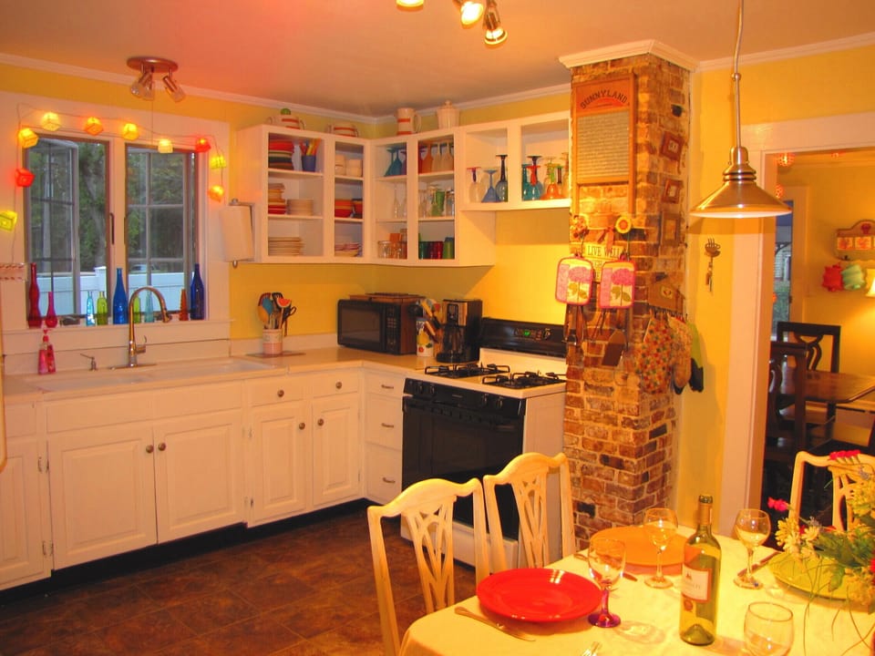 Sunny eat-in kitchen with farmers sink